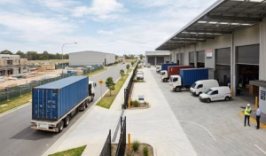 Industrial warehouse and few vans and lorries outside of the industrial warehouse